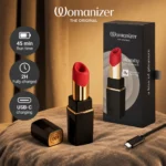 Womanizer Beauty Black/Gold clitoral stimulator with its retail packaging and included accessories.