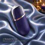 Blue Amazing compact tongue massager with clear cover on blue satin.
