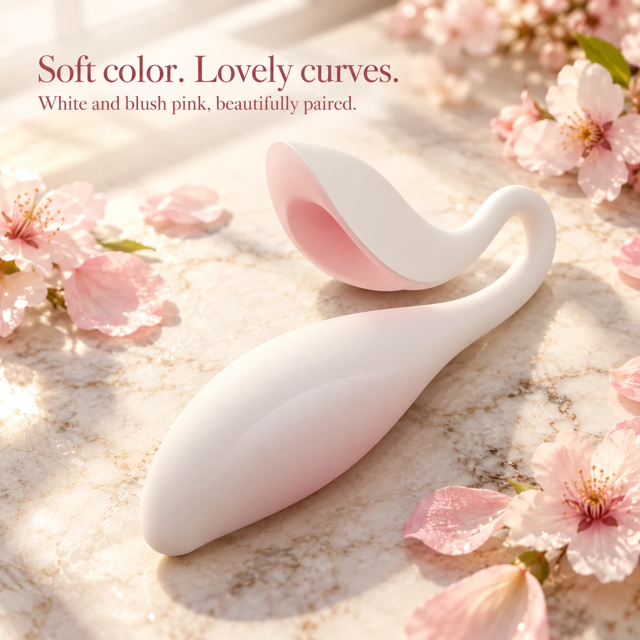 Coco Seed compact silicone vibrator in white and blush pink among delicate blossoms