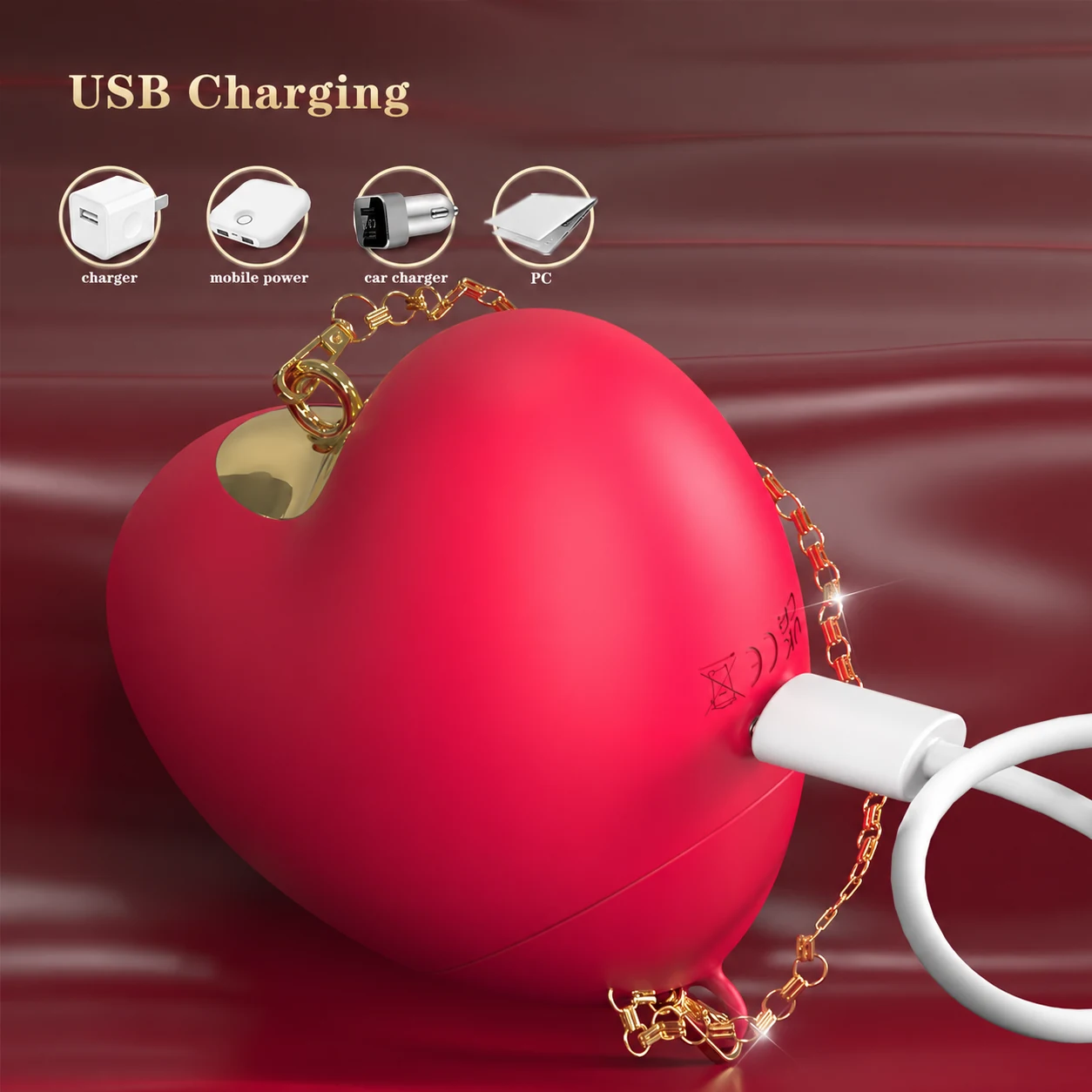 Rose-red Cupid’s Heart connected to its magnetic USB charging cable.