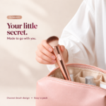 Glimmer brush vibrator held above an open blush cosmetic bag for compact storage.
