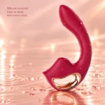 Selene suction and G-spot vibrator in Wine Red, shown with water droplets and a rose-gold grip ring.